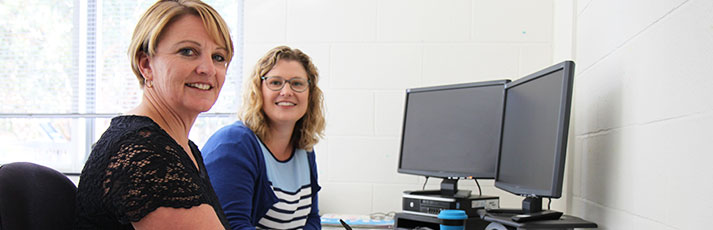 two ladies at a desk