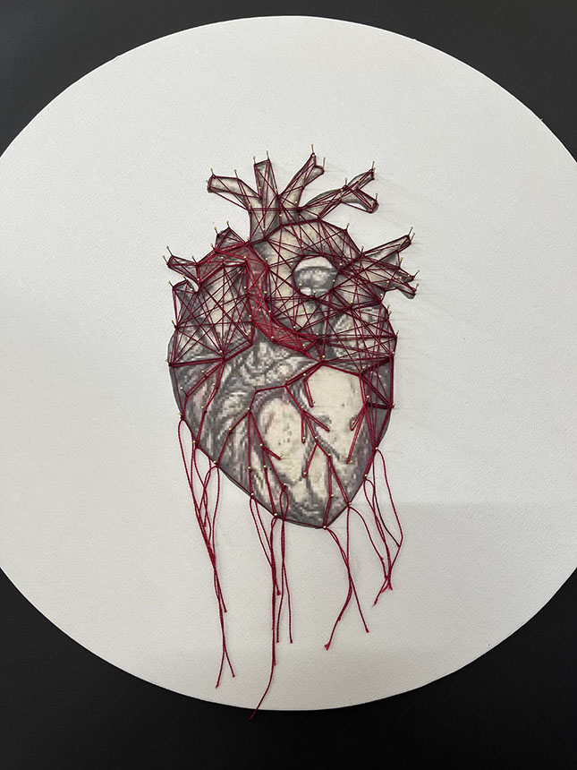 Image of a human heart printed and sewn on canvas