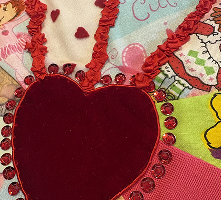 Crazy Childhood, 2025 coloured fabric with a red heart & beads and sequins
