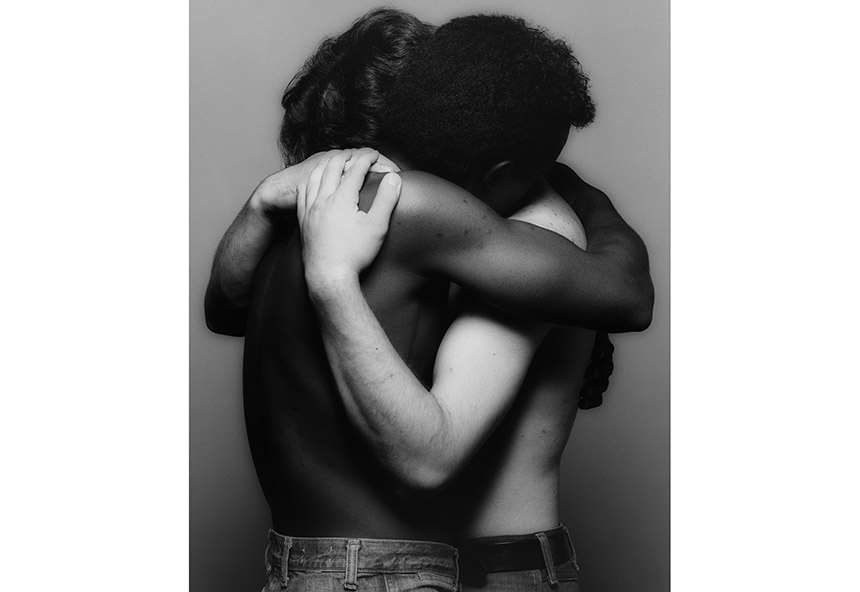 Robert Mapplethorpe Embrace,1982 a white and black man hugging