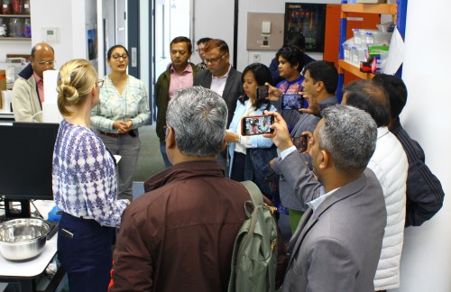 Dr Surbhi Sharma and Dr Alicia Reynolds welcome the CSRIO delegates to the CCS laboratory. 