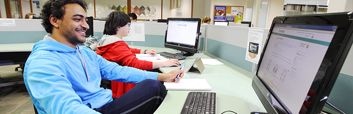 Students on computers and tablets